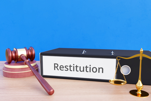 A new report says saddling young offenders with debt, such as restitution, limits their opportunities for positive growth that can keep them out of trouble in the future. (Adobe Stock)