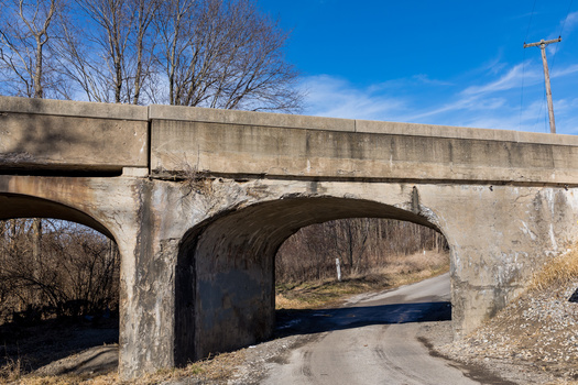 In addition to crumbling roads in rural areas, the Wisconsin Department of Transportation rates 980 bridges across the state as structurally deficient. (Adobe Stock)