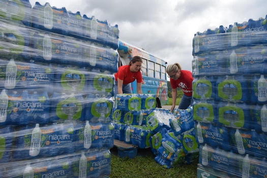Save the Children staff at an elementary school in Perry County, preparing to distribute bottled water and supplies to residents. (Save the Children)