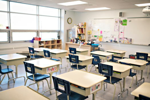 An annual report on child well-being finds Iowa has some stronger results in education, including the percentage of high school students graduating on time. But certain proficiency metrics drag down the state's overall performance. (Adobe Stock)
