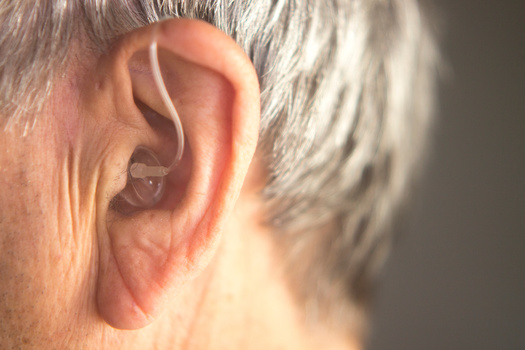 hearing aids are not covered under Medicare or most insurance plans. (EdwardOlive/Adobestock)