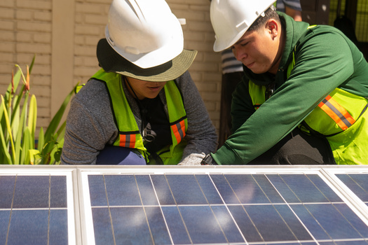Latino workers are getting training in green-energy job skills through a pilot program, but some face roadblocks trying to balance a new career path with maintaining two or three other jobs to support themselves. (Adobe Stock)