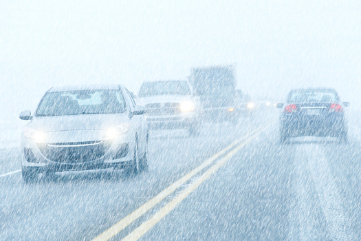 Working headlights are an important component of safe driving when it's snowing. (mario beauregard/Adobe Stock)