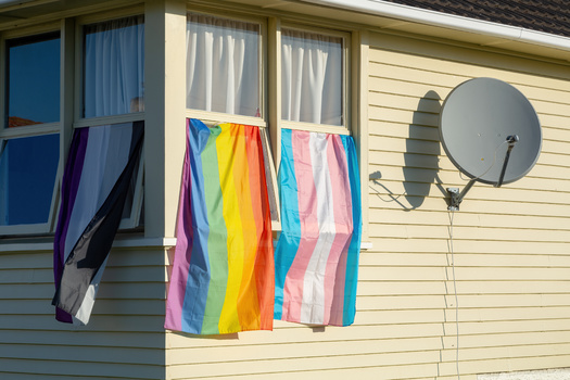 Displaying flags associated with the LGBTQ community is a protected action under the Fair Housing Act. (Michael/Adobe Stock)