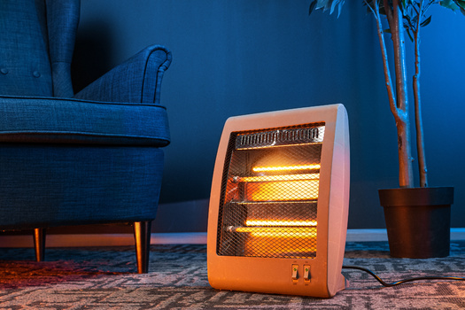 Fire-safety experts recommend keeping space heaters at least three feet away from things that can burn, such as paper, bedding or furniture. (Adobe Stock)