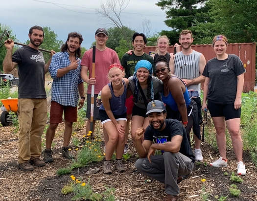 Jon Kent (kneeling) and a cadre of volunteers are raising vegetables and feeding the community from their urban farm at Charlevoix and Lakeview streets in East Detroit. (Sanctuary Farms)