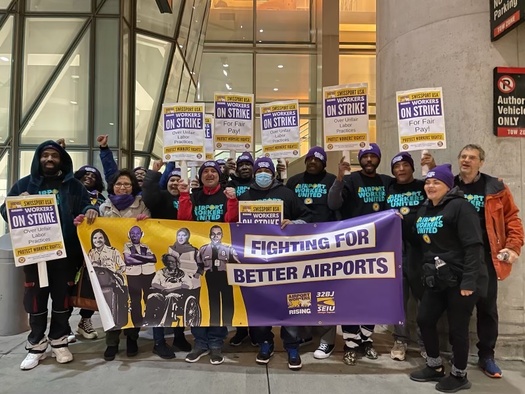 Service workers employed by Swissport USA at Boston's Logan International Airport take part in a strike on December 8th, 2022 citing wage theft and unfair labor practices. (32BJ SEIU)