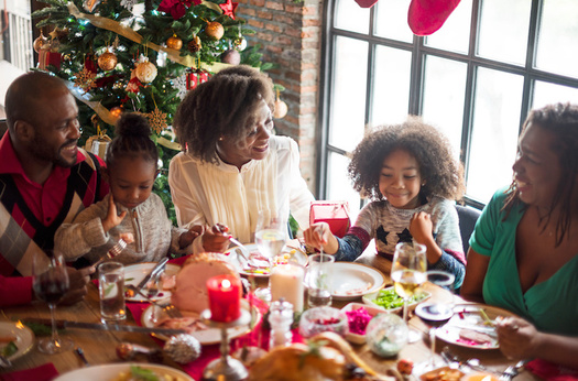 Research has shown gatherings where people are eating and drinking can increase the risk of getting and spreading COVID-19 among people who are not fully vaccinated. (Adobe Stock)