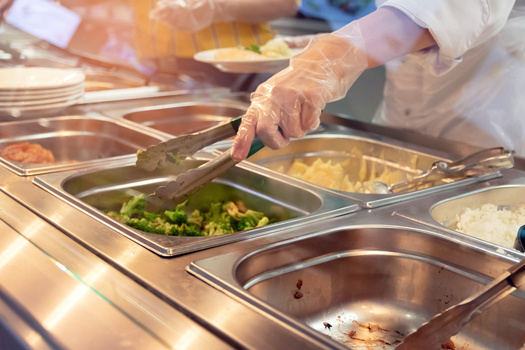 Supporters of providing free school meals to all students say it removes administrative and registration headaches for both schools and parents. (Adobe Stock)