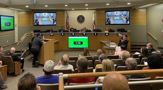 Members of Communities for a New California speak at a redistricting hearing in Indio. (Anna Lisa Vargas)