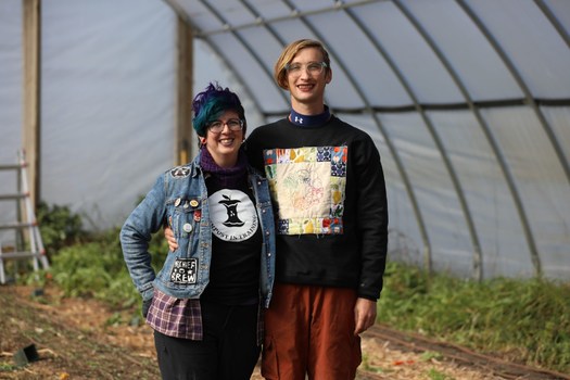 Shannon Mingalone, left, and Eve Mingalone are seen in their hoop house at their business Ramshackle Farm in Harvard, Illinois, on Oct. 19, 2022. (Photo courtesy of Coburn Dukehart/Wisconsin Watch)