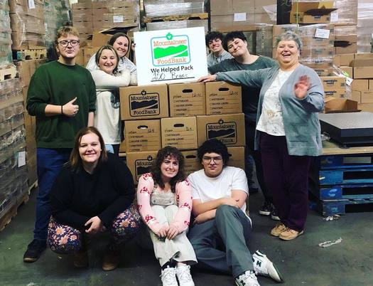 Volunteers pack boxes at Mountaineer Food Bank in Gassaway, West Virginia. (Mountaineer Food Bank/Facebook)