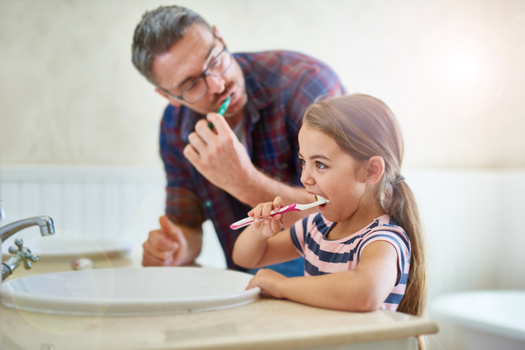 The CDC recommends parents assist children under age 6 with brushing their teeth until they have developed good brushing skills. (Cecilie Skjold Wackerhausen/Adobe Stock)