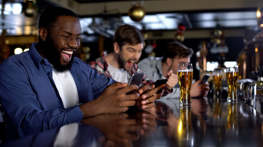 Problem gambling experts say commercials for sports betting apps often portray the activity as a fun, social event, with not enough information about the potential risks. (Adobe Stock)