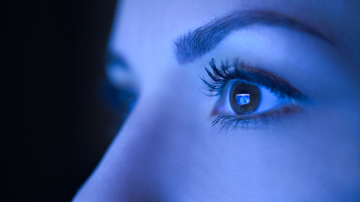 Eye-care professionals say limiting screen time before bedtime, using blue light-blocking filters on your devices, and wearing blue light-blocking glasses can all help protect from potential health risks. (Adobe Stock) 