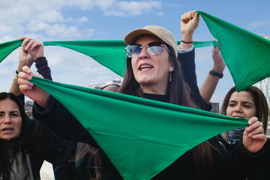 The green scarf is a symbol of the abortion-rights movements, created in Argentina in 2003 and popularized in the United States in 2022. (Clara/Adobe Stock)