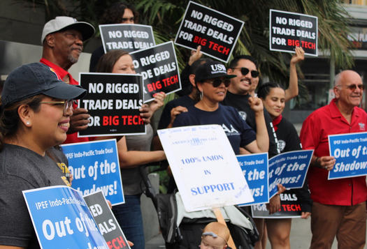 Labor, consumer and environmental advocates rallied in front of the APEC meeting in Los Angeles last September. (Will Wiltschko)
