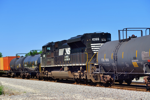 Norfolk Southern freight trains are common sights along Indiana highways. (Adobe Stock)