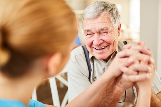 Beyond providing relief to family caregivers, adult day-care programs create opportunities for people living with dementia to be in social settings with professional supervision. (Adobe Stock)