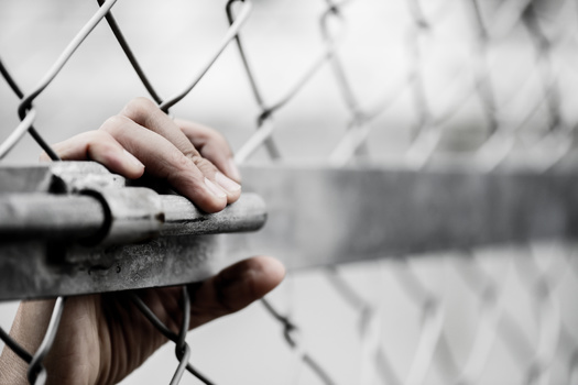Nearly 60% of Massachusetts' incarcerated population is Black - but Black residents make up less than 20% of the Commonwealth's population, according to the Democracy Behind Bars Coalition. (Adobe Stock)