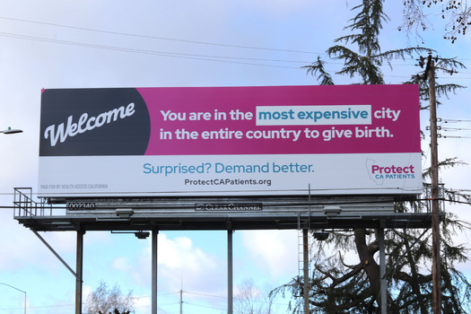 A billboard calls attention to the rising cost of giving birth in the Sacramento area, something advocates attribute to health-care mergers in the region. (Protect California Patients campaign)