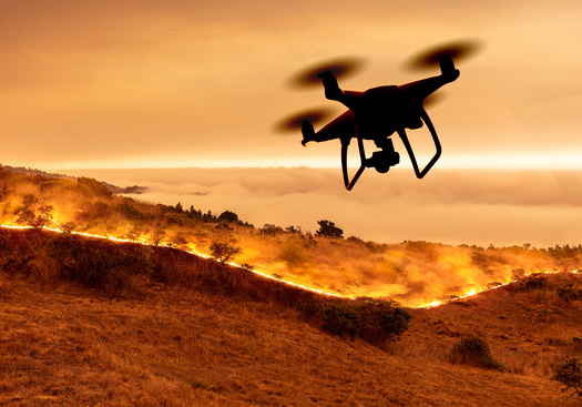 Wildfire experts plan to use unmanned drones to help improve early detection, battle fires more effectively, and to reseed and restore scarred forests. (Windsong/Adobe Stock)