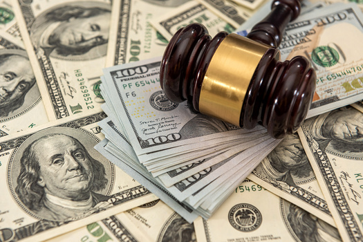 In New York and several other states, a person's inability to pay does not exempt them from owing certain court fees and surcharges, according to a report by the Fines and Fees Justice Center. (Adobe Stock)