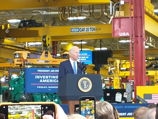 President Joe Biden speaks to an audience gathered at the Cummins Inc. facility in the Minneapolis suburb of Fridley. He was there to tout his administration's policies that offer investments in manufacturing, infrastructure and clean-energy technology. (Mike Moen/PNS)