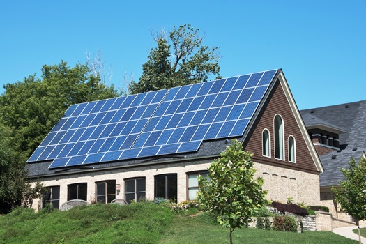 Investing in solar produces zero carbon emissions and other heat-trapping greenhouse gases and improves cost efficiency over time, which will end up saving on energy bills, according to Iowa Interfaith Power and Light. (Adobe Stock)