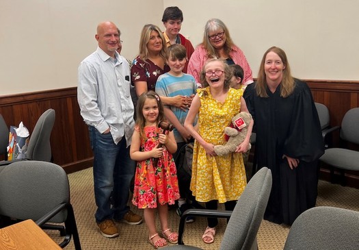 Samantha, in the yellow dress, on her adoption day. The Dave Thomas Foundation is celebrating reaching 13,000 adoptions in both the United States and Canada.(Aaryn McGregor)