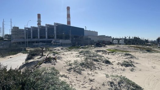 The Scattergood Generating Station's iconic red-and-white emissions stacks will be obsolete when it adds a hydrogen-burning unit in 2029. (Caleigh Wells)