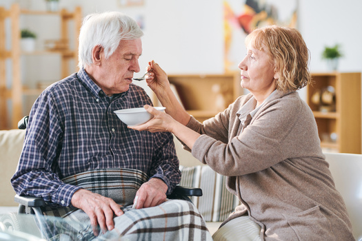 Across the nation, AARP says the estimated economic value of family caregivers' unpaid contributions now stands at $600 billion. (Adobe Stock)