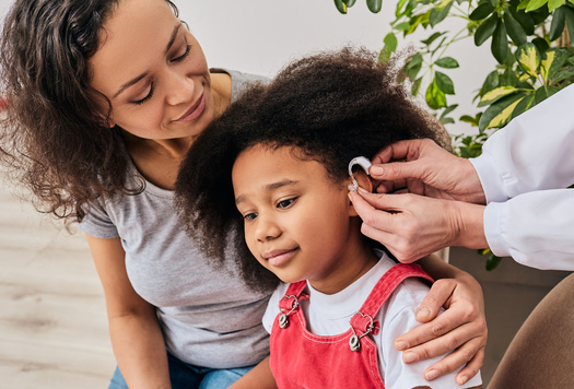 Lawmakers have requested an analysis of the impact of an insurance mandate for kids' hearing aids from the California Health Benefits Review Program. The report is due June 7. (Peakstock/Adobestock)
