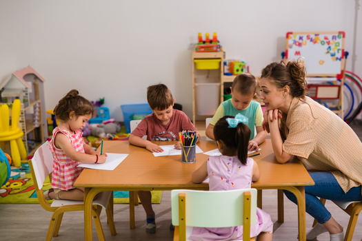 The 2023 Kids Count Data Book reports the median pay for child care workers, who typically must hold a range of credentials, was $28,520 per year or $13.71 an hour in 2022. (Cherryandbees/Adobe Stock)