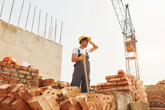 OSHA says when developing heat illness prevention plans, companies should have a person on their job site to monitor others for potential signs of heat stroke. (Adobe Stock)