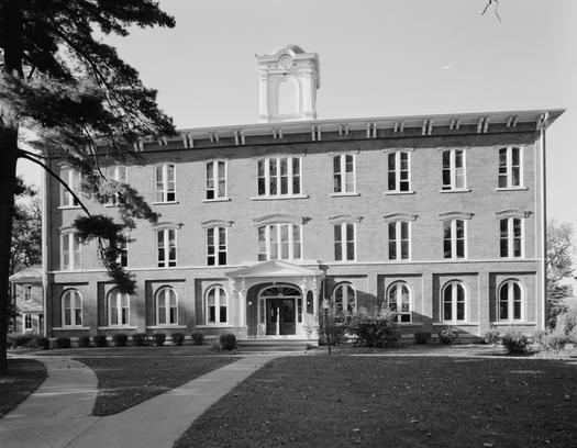 Iowa Wesleyan University was able to continue operating after receiving donations from alumni and a $26 million USDA loan. In 2023, the university's board of trustees voted unanimously in favor of closure after Gov. Kim Reynolds determined that a loan of $12 million would not be feasible. (Old Main Hall at Wesleyan University/Library of Congress) 