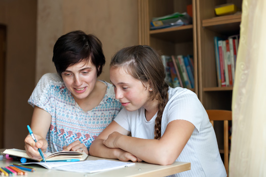 Organizers behind a community-driven approach in South Dakota to prevent child maltreatment say residents volunteering as tutors can be one way to provide much-needed stability for at-risk youth. (Adobe Stock)