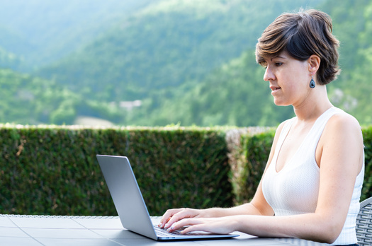 With more federal funding coming Minnesota's way to improve broadband access, advocates said it might create more remote work opportunities for those who want to move to rural areas. (Adobe Stock)