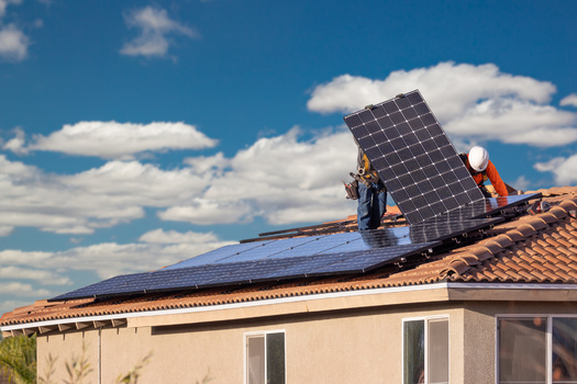 Credit unions are lending to households and small businesses to install solar and other improvements, which are costly up front, loans frequently considered too small by bigger banks. (Adobe Stock)