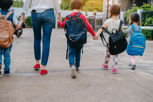 A trusted adult can be an important resource for kids during their first week of school. (Kiattisak/Adobe Stock)