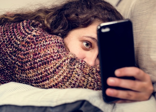Behavioral health specialists often sound the alarm over the impact social media has on teens, especially if they're online most of the day. Experts say parents can help by setting good examples and limiting their own screen time. (Adobe Stock)