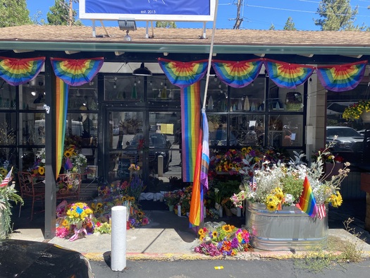 A memorial has spring up outside Lauri Carleton's store in Cedar Glen, Calif., in the wake of her murder. (Michael Feddersen)