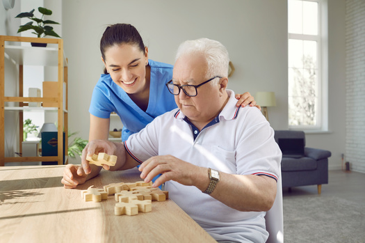 Some 70% of Michigan residents are either currently providing care or have provided care in the past for an adult relative or friend. (Studio Romantic/Adobe Stock)