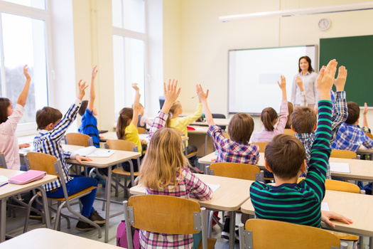 Health experts say if a student in the classroom is the only one not frequently raising their hand to answer a question, it might signal a deeper issue, such as hearing loss. (Adobe Stock)