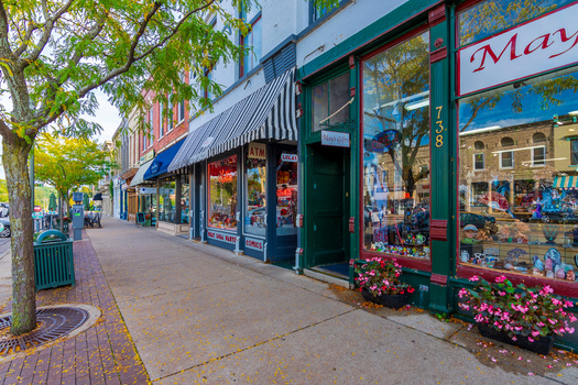 Policy analysts say if retail chains flood too many small towns, pushing out Main Street businesses in the process, these communities could lose tourists looking for places like boutiques and independent bookstores. (Adobe Stock)