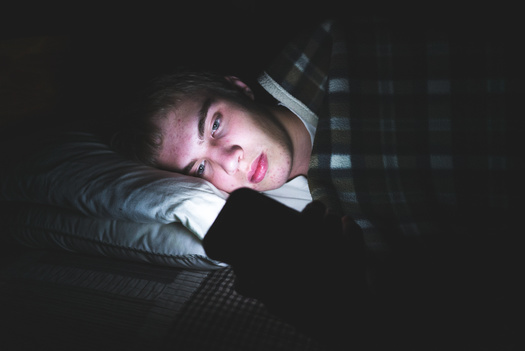 Screen time before bed can be especially detrimental for teenagers and their developing brains. (Brian/Adobe Stock)
