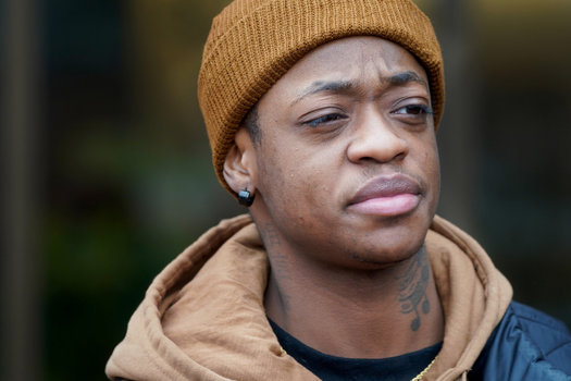 Nizer Lukerson, a delivery driver, stands outside Cleveland Heights City Hall after appearing in municipal court for driving under suspension. Lukerson owes $1,000 in fines to remove a number of suspensions issued in local courts for minor infractions. (GUS CHAN FOR THE MARSHALL PROJECT)