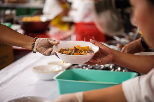 Food banks provide a crucial service, but federal programs such as SNAP are critical to fighting hunger. (kuarmungadd/Adobe Stock)