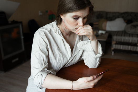 According to experts, keeping your smartphone's security software up to date is one way for domestic violence survivors to protect themselves from technology-facilitated abuse. (Adobe Stock)