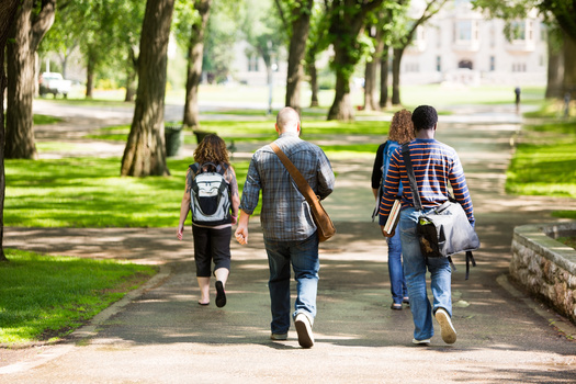 People with additional years of education beyond high school tend to be more civic-minded and interact more with neighbors and family members, according to a recent Gallup poll. (Tyler Olson/Adobe Stock)